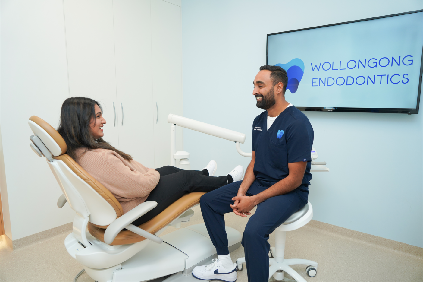 Specialist endodontist Dr Deepak Chellappa with a patient at Wollongong Endodontics