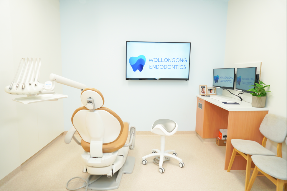 Specialist treatment room at Wollongong Endodontics featuring operating microscope and dental chair